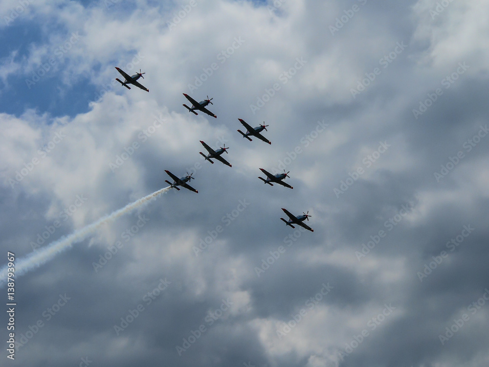 Squadron of fighter jets in clouds on sunny day Squadron of fighter jets in clouds on sunny day