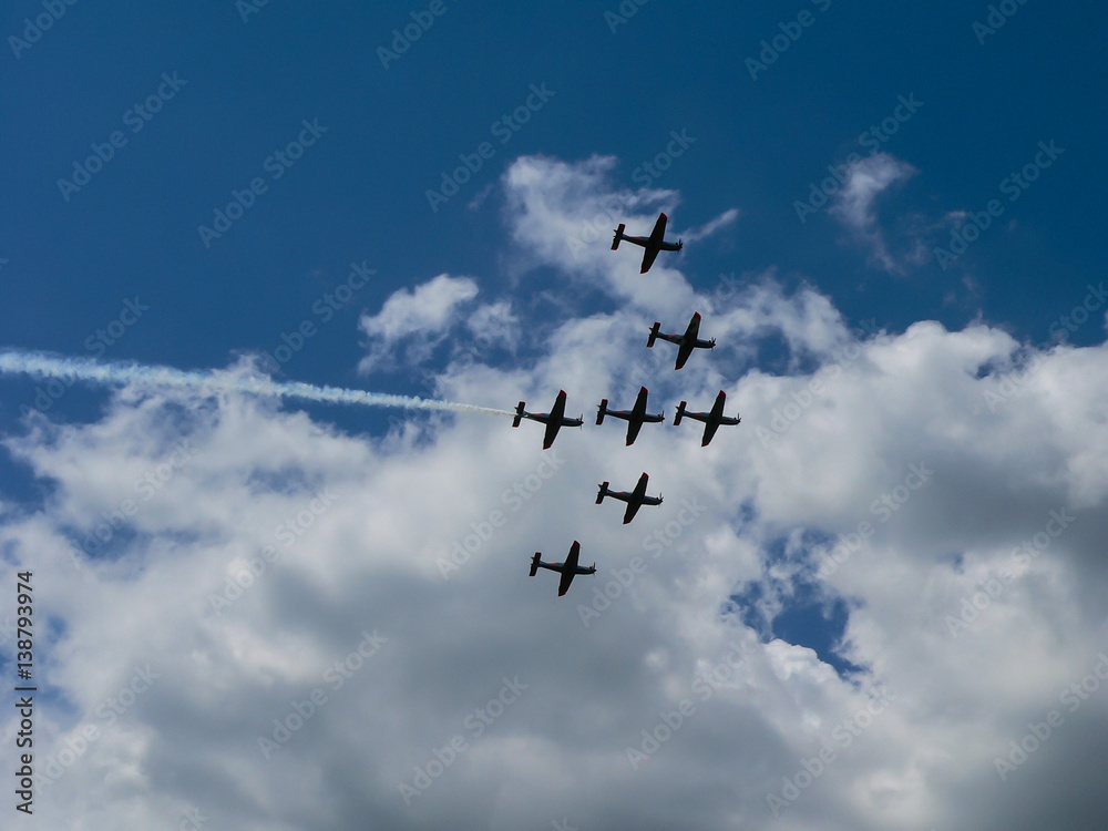Squadron of fighter jets in clouds on sunny day Squadron of fighter jets in clouds on sunny day