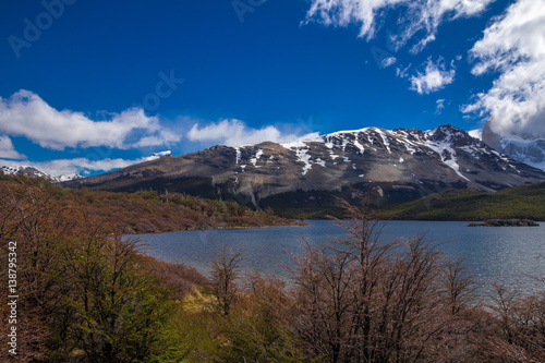 Landscape with the lake Capri in Patagonia with the view on Fitz Roy mountain covered with snow and clouds.