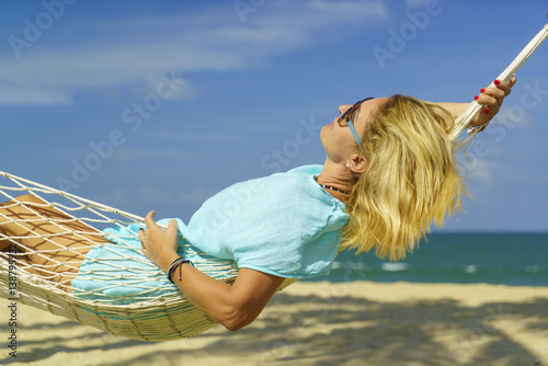 Fototapeta Naklejka Na Ścianę i Meble -  Woman relaxing at the beach