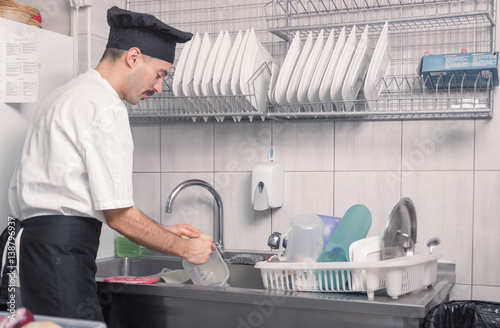 chef washing dishes kitchen