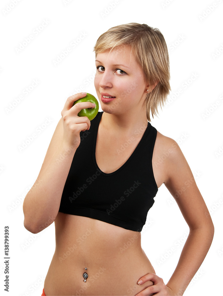 Beautiful young woman holding green apple