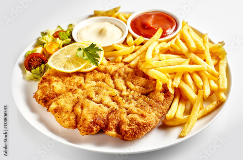 Dish of Wiener schnitzel with French fries