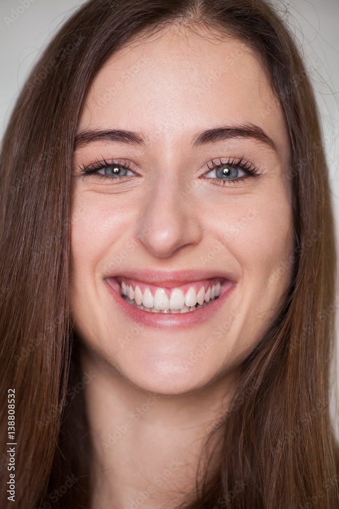 close up portrait of beautiful young woman face close up portrait of beautiful young woman face