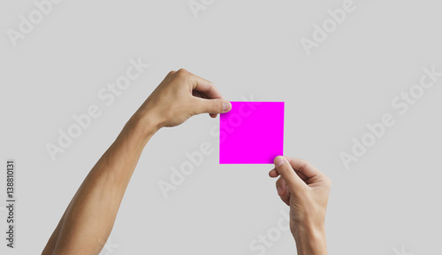 Two hands holding square paper in the hand. Leaflet presentation. Pamphlet hand man. Man show offset paper. Sheet template. Book in hands. Booklet folding design. Fold paper sheet display read.