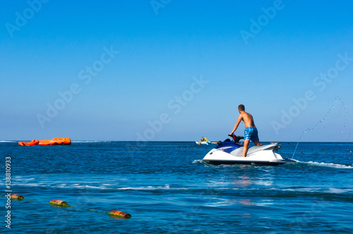 man riding a jet ski at sea photo