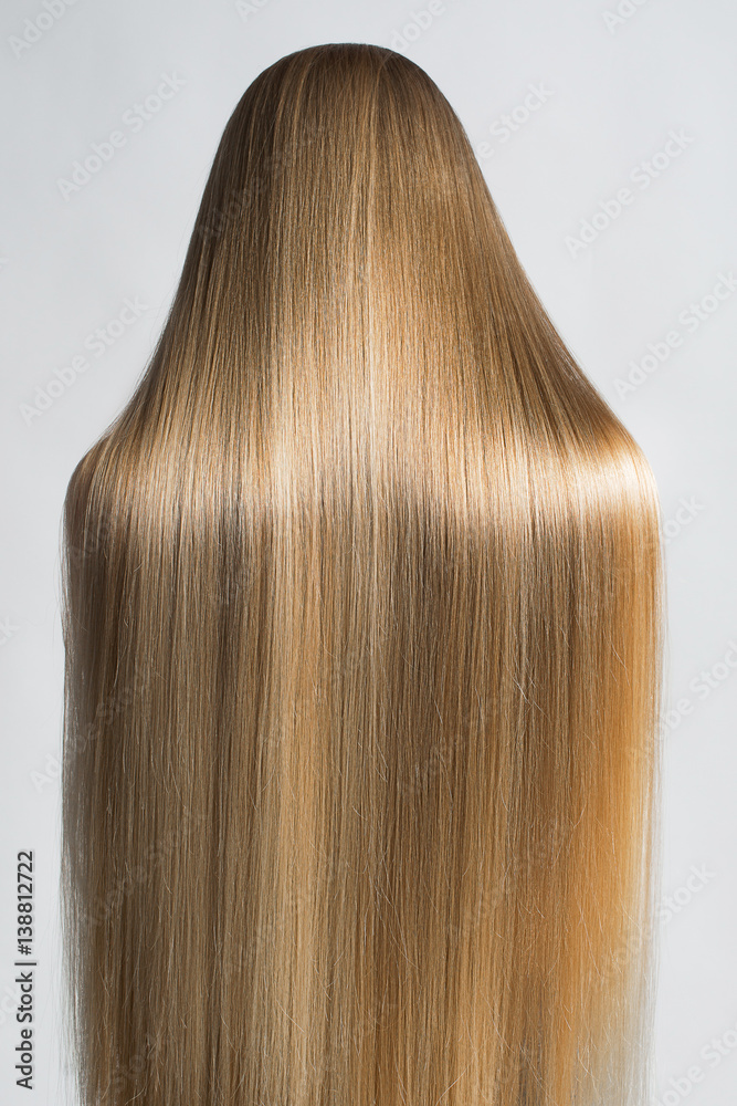 Portrait Of A Beautiful Young Blond Woman With Long Straight Hair. Back View Portrait Of A Beautiful Young Blond Woman With Long Straight Hair. Back View