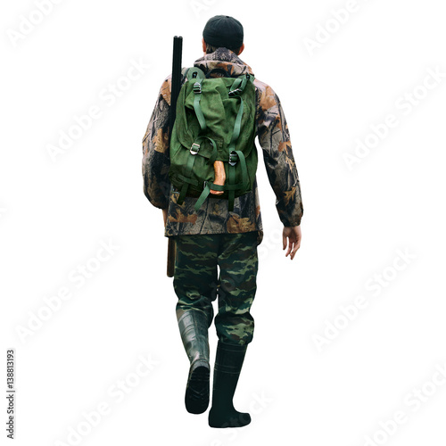 The man is a hunter with a shotgun and backpack. Back view. Man isolated on white background.
