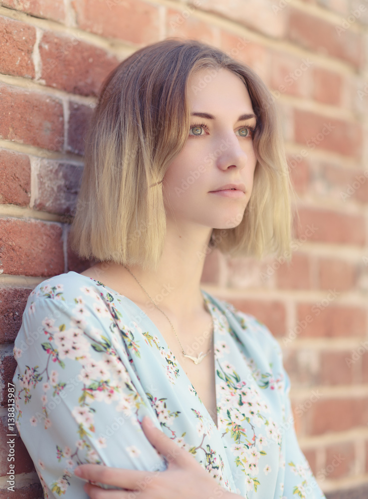 Outdoors portrait of beautiful young woman with green eyes. Outdoors portrait of beautiful young woman with green eyes.