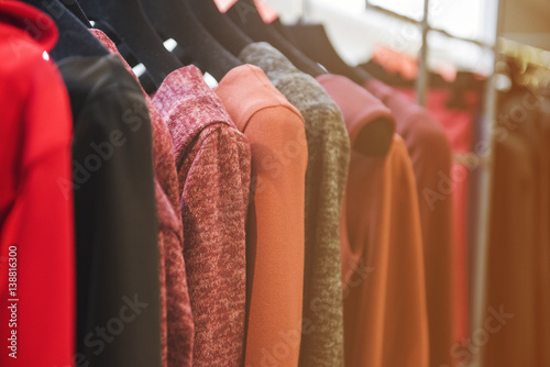 Women clothes on racks in a boutique store