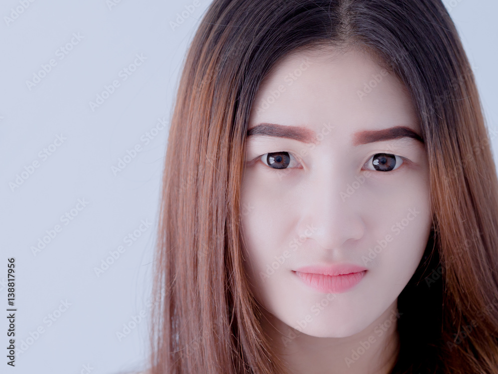 Obraz premium Portrait of Asian woman in white vest, expressing the idea of broken heart and sadness. hopeless and await, concept. white tone.