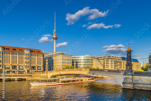 Berlin city center with ship on Spree river at sunset in summer  Germany
