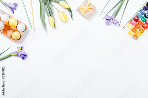 Festive Easter arrangement of flowers, painted eggs and watercolor