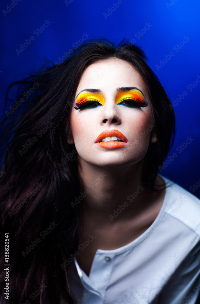 pretty sexy woman with fashionable bright orange makeup