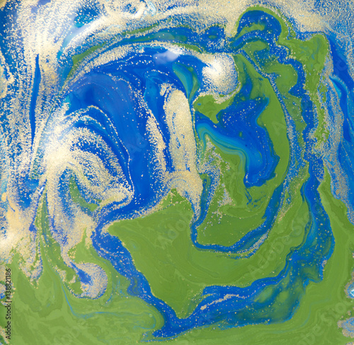 Blue, green and gold liquid texture. Hand drawn marbling background. Ink marble abstract pattern