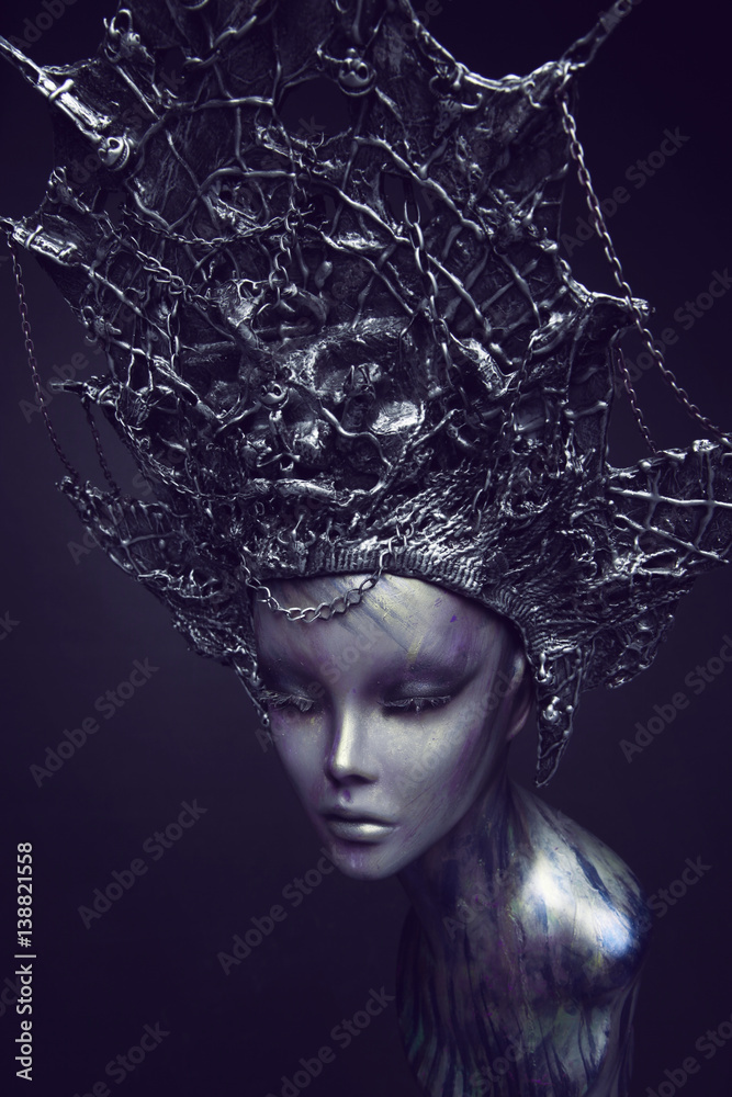Mannequin in metallic headwear with chains Mannequin in metallic headwear with chains