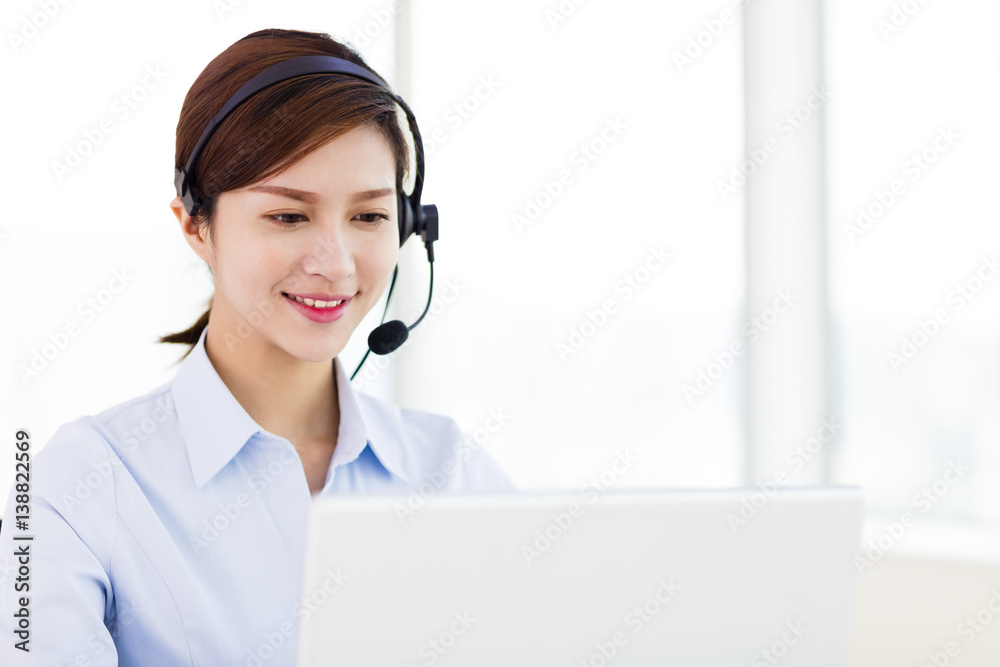 young business Woman wearing headset in office young business Woman wearing headset in office