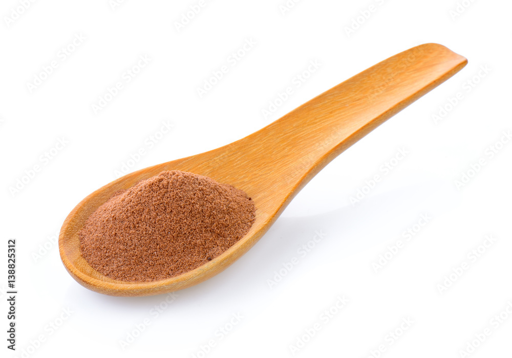 malt extract in wood spoon on white background malt extract in wood spoon on white background
