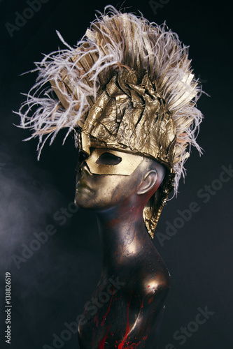 Mannequin in head wear with feathers