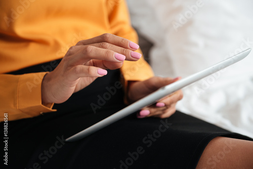 Woman using tablet computer indoors