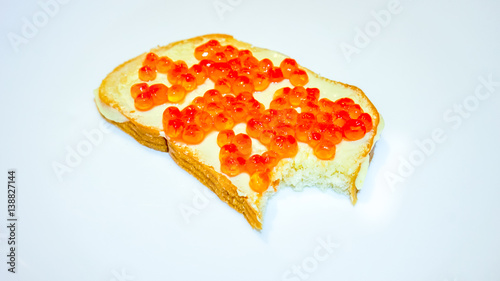 delicious appetizing sandwich with red caviar on light background photo
