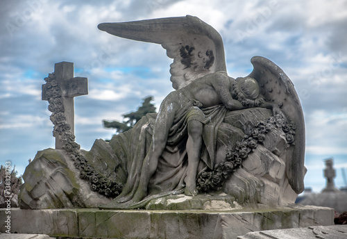 Canvas Print Sculpture of a sad angel on a cemetery