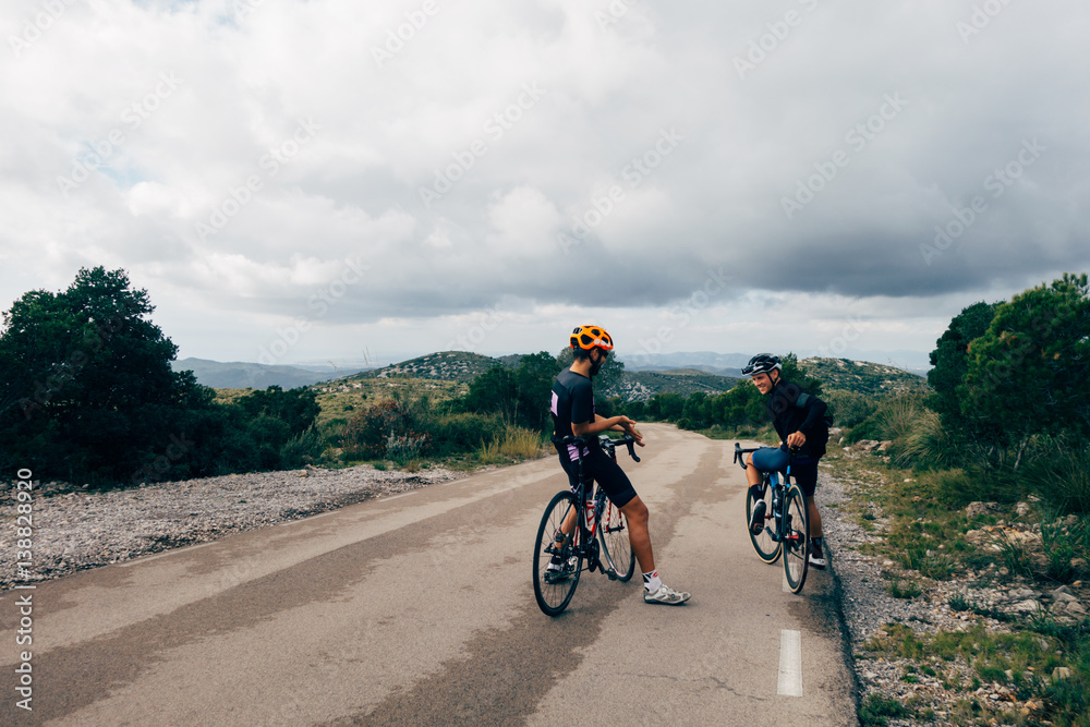 Naklejka premium Two road cyclists talking