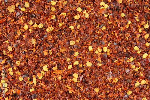 crushed red pepper flakes closeup food background texture
