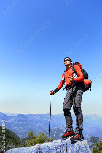 A man on foot hike in the mountains.