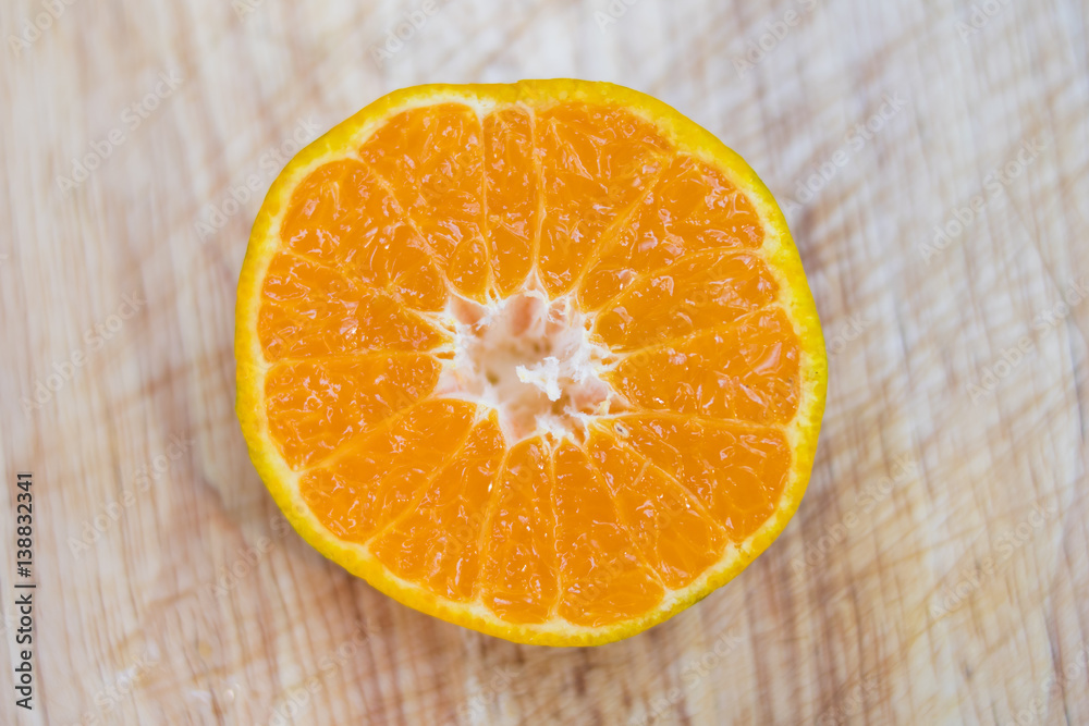 sliced oranges on wooden table sliced oranges on wooden table