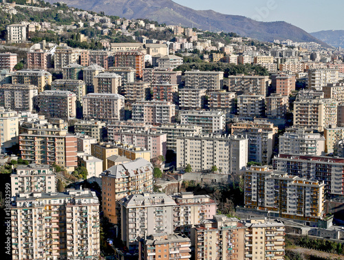 Cityscape with residential buildings in the hills.