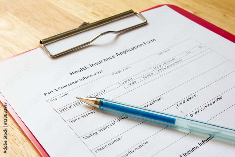 Blank health insurance application form with pen wait for fill data Blank health insurance application form with pen wait for fill data