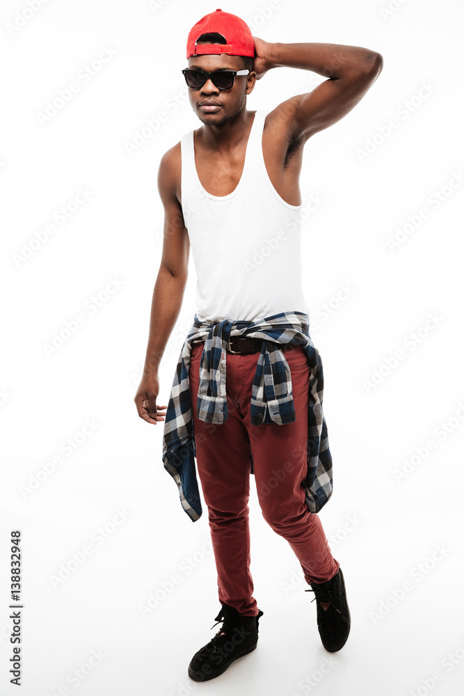 Handsome young african man wearing cap and sunglasses Handsome young african man wearing cap and sunglasses