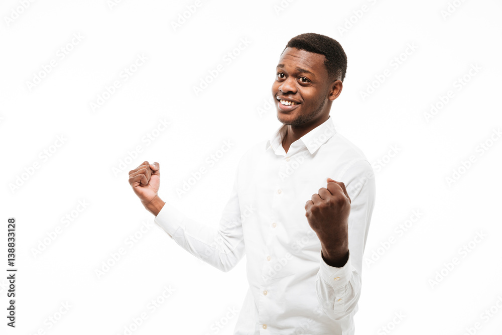 African man make winner gesture. African man make winner gesture.