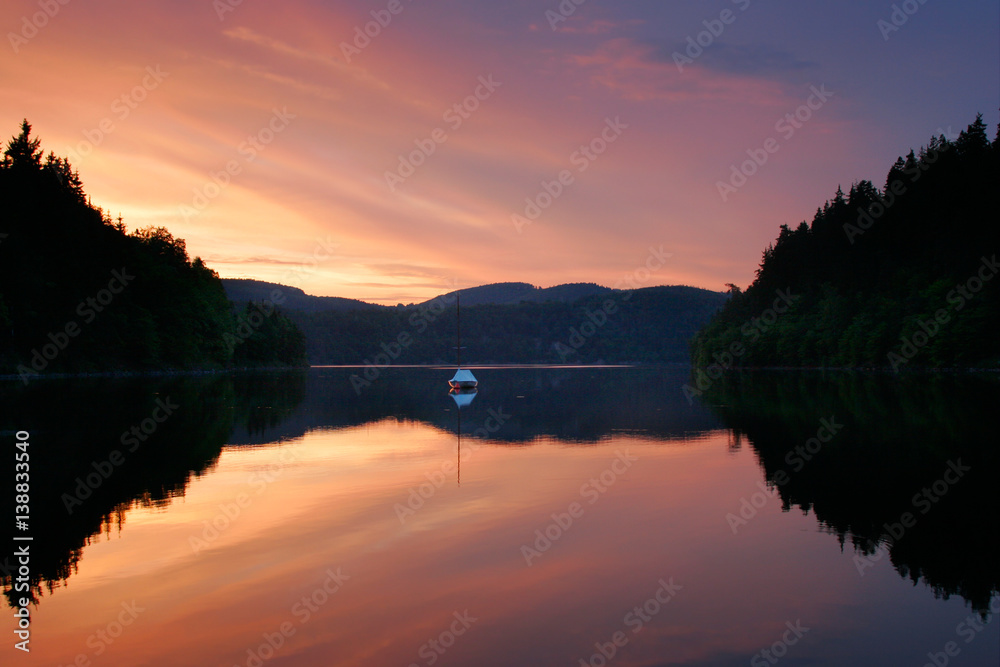 Calm Mountain Lake at Sunset, Small Sailing Boat Stock-Foto | Adobe Stock