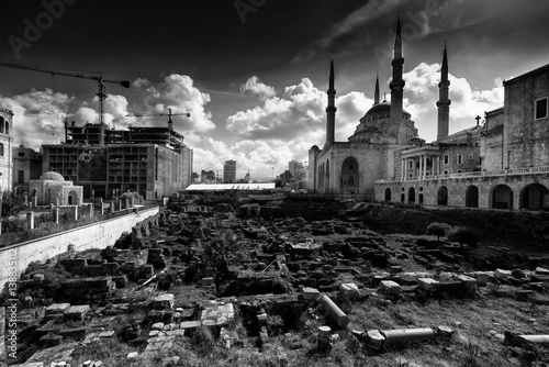 A view of the Saint George Maronite Cathedral and the Mohammad Al-Amin Mosque at the historic centre of Beirut, Lebanon. Ancient Roman, Hellenistic, Byzantine ruins on the foreground. photo