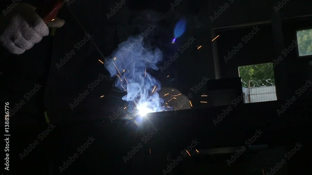 Welding Metal Form Process with Sparks Fountain Closeup Welding Metal Form Process with Sparks Fountain Closeup