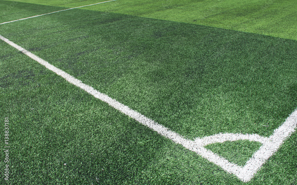Obraz premium Soft focused picture of The corner of Football field or soccer field covered with artificial grass