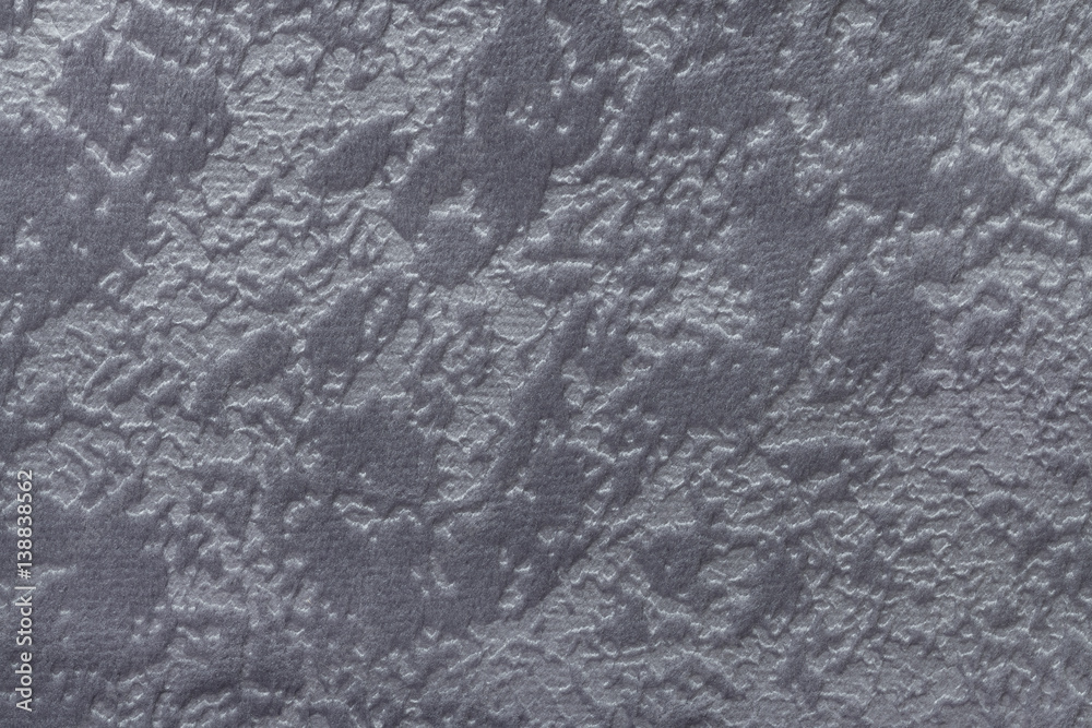 Fototapeta premium Gray background from a soft upholstery textile material, closeup.