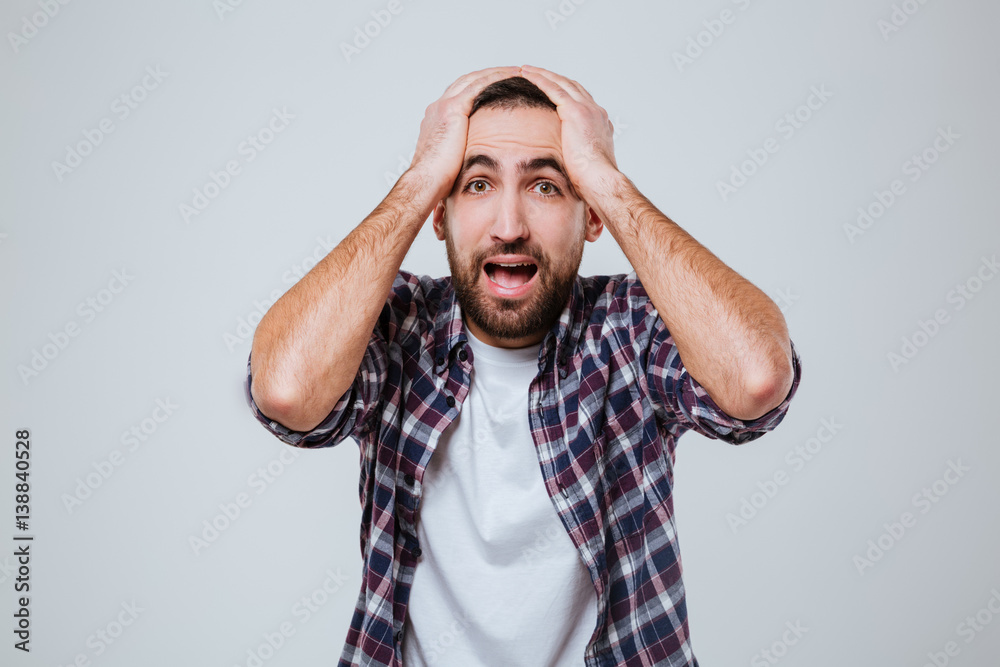 Overwhelmed bearded man in shirt Overwhelmed bearded man in shirt