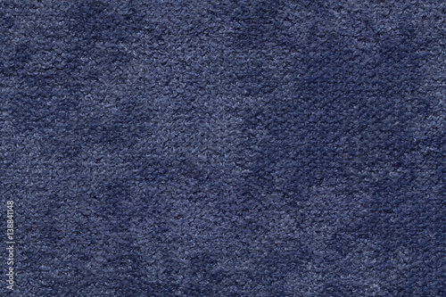 Navy blue fluffy background of soft, fleecy cloth. Texture of textile closeup