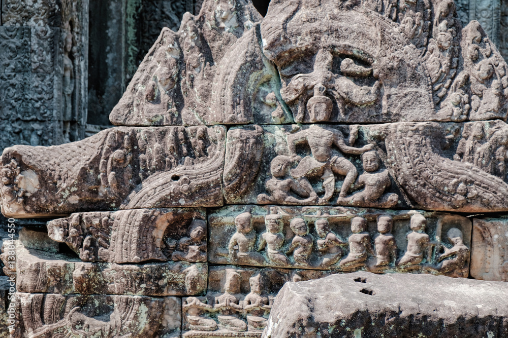 Fragment of old wall in the Preah Khan Temple in Siem Reap, Cambodia. Selective focus