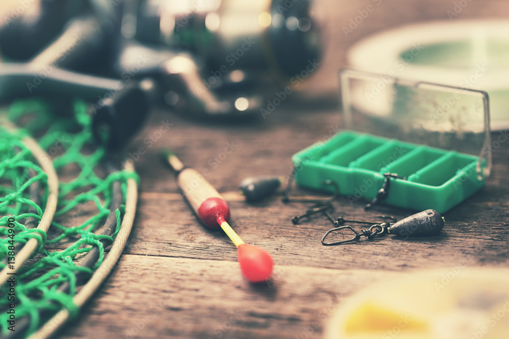closeup of fishing tackle on wood table