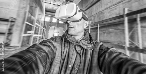 Construction worker indoor wearing vr eyeglasses