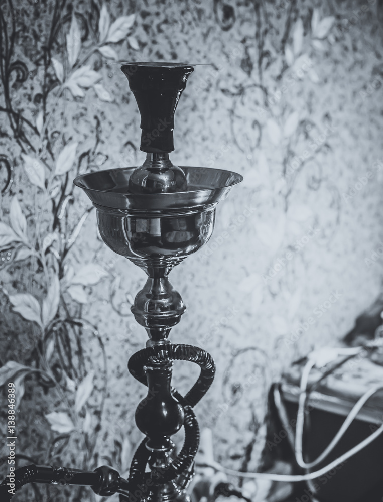 Naklejka premium Big hookah for tobacco made of metal, glass and ceramics