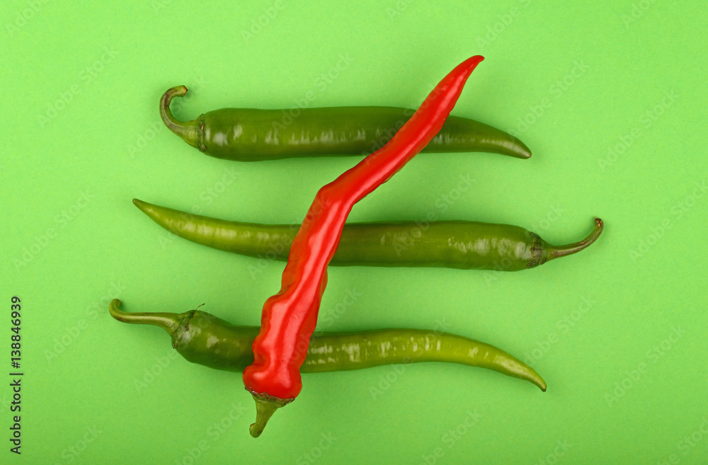 Green fresh jalapeno and red hot chili peppers