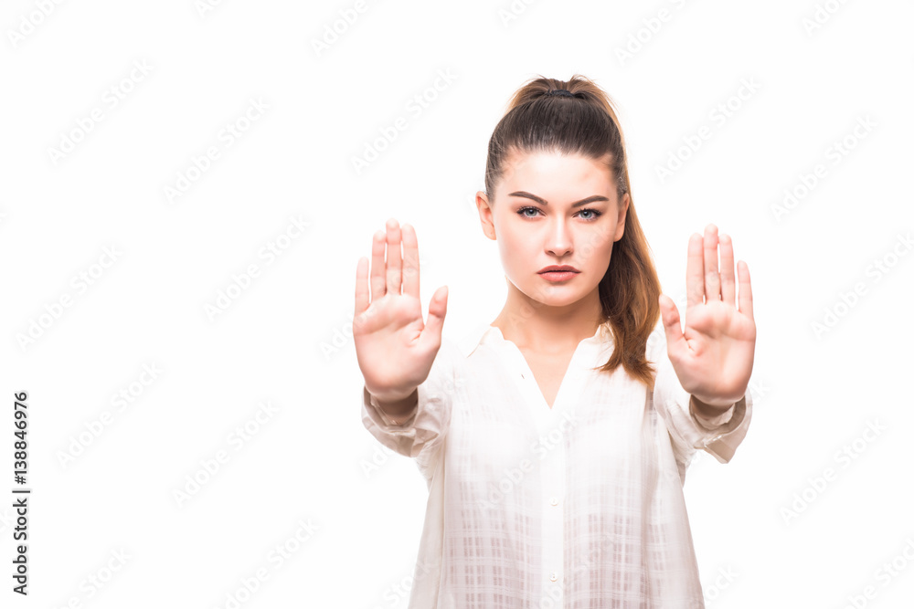 Serious business woman making stop hand sign Serious business woman making stop hand sign