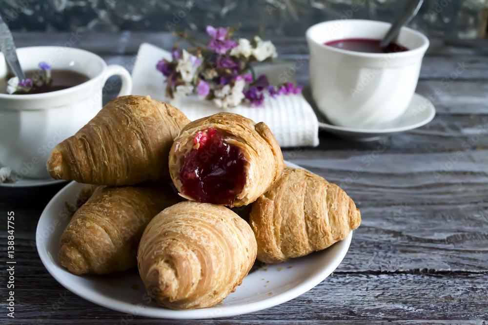 Fresh croissants with fruit tea Fresh croissants with fruit tea