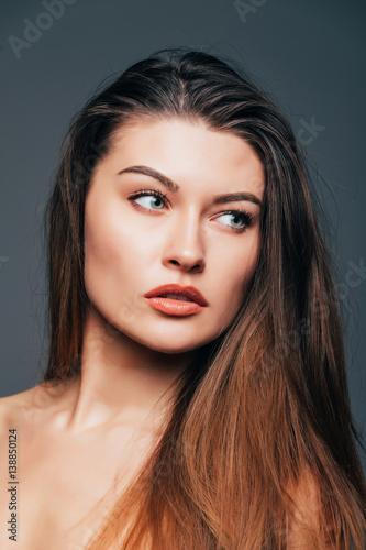 Close up of face beauty girl skin on grey background. Cosmetics or spa, healtcare concept.