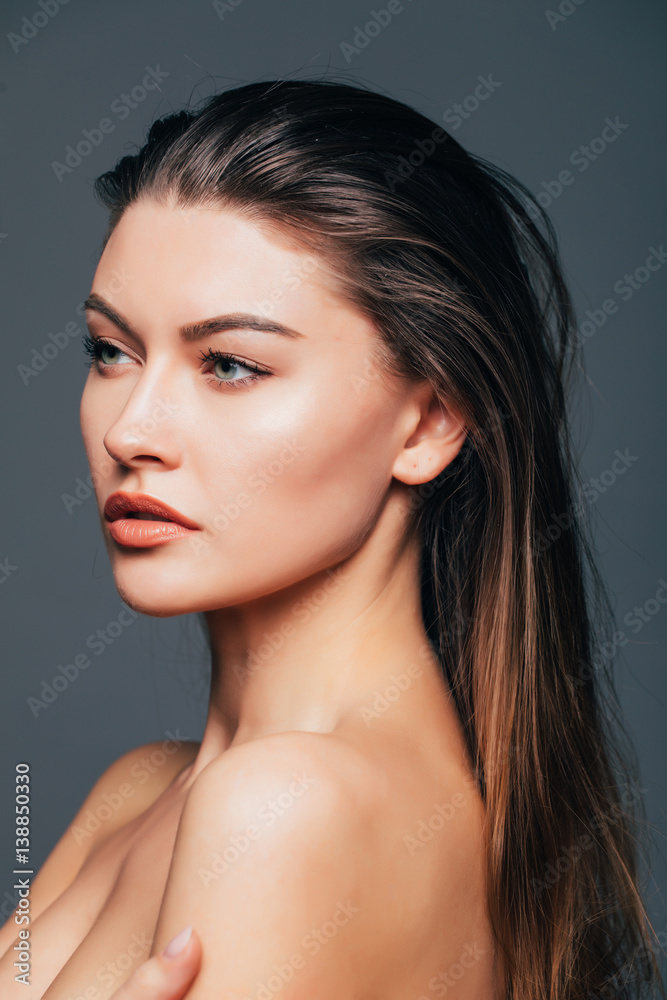 Close up of face beauty girl skin on grey background. Cosmetics or spa, healtcare concept.